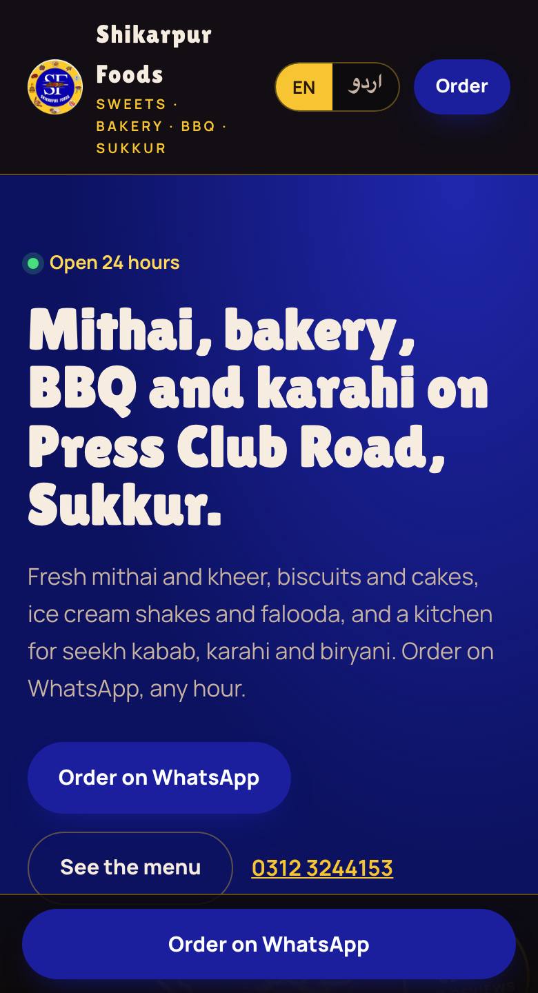 Shikarpur Sweet and Bakers website on a phone